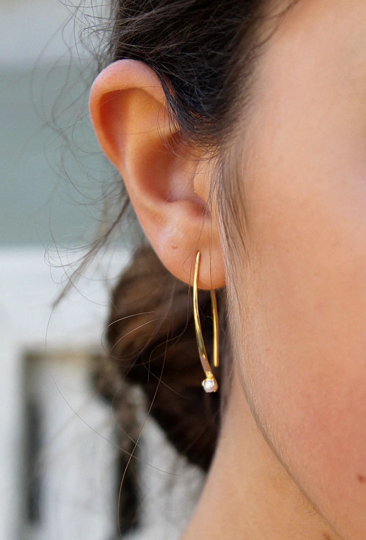 Gold curved bar earrings with seed pearl