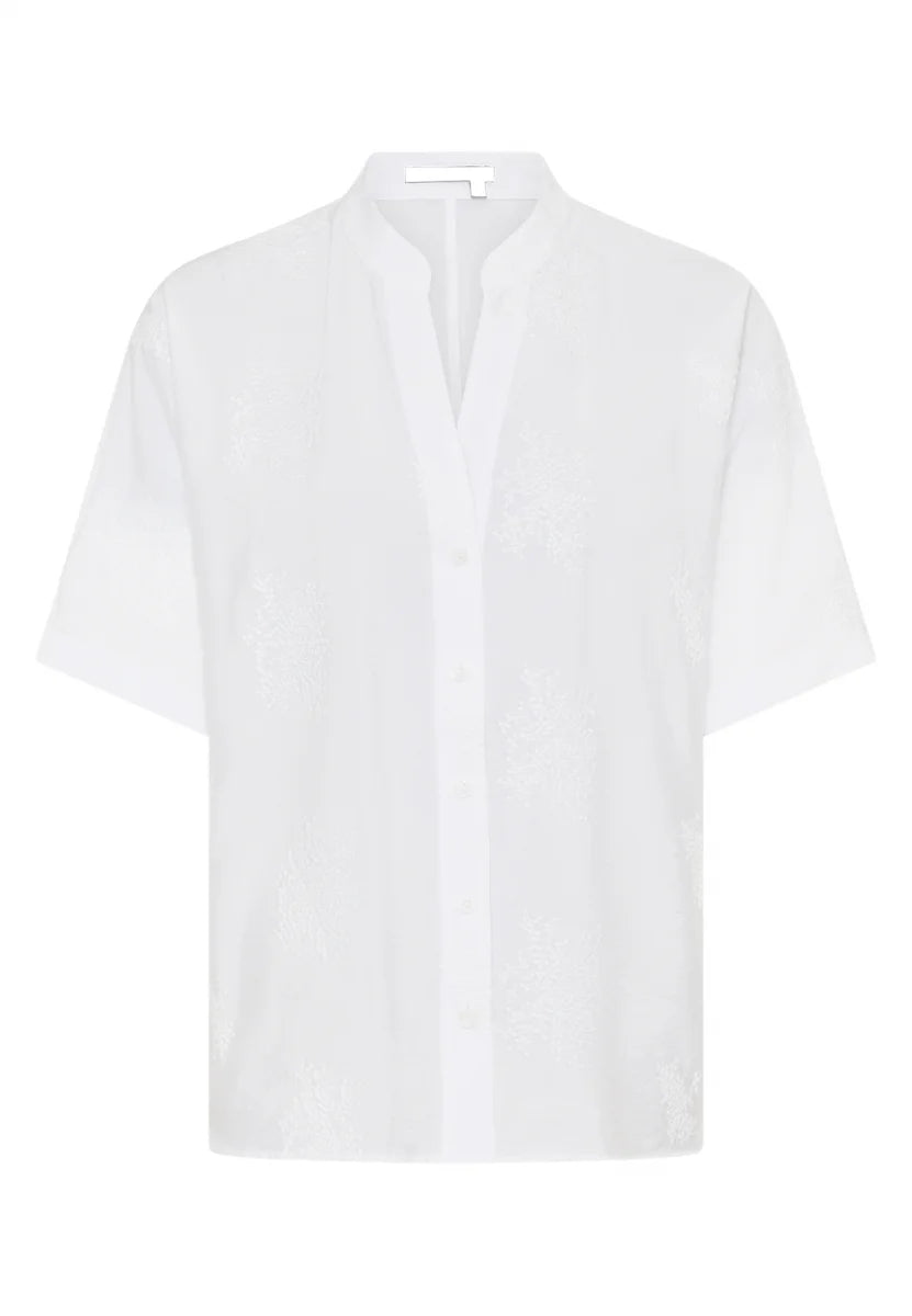 White Tunic blouse made from embroidered fabric