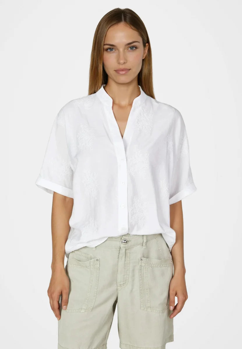 White Tunic blouse made from embroidered fabric