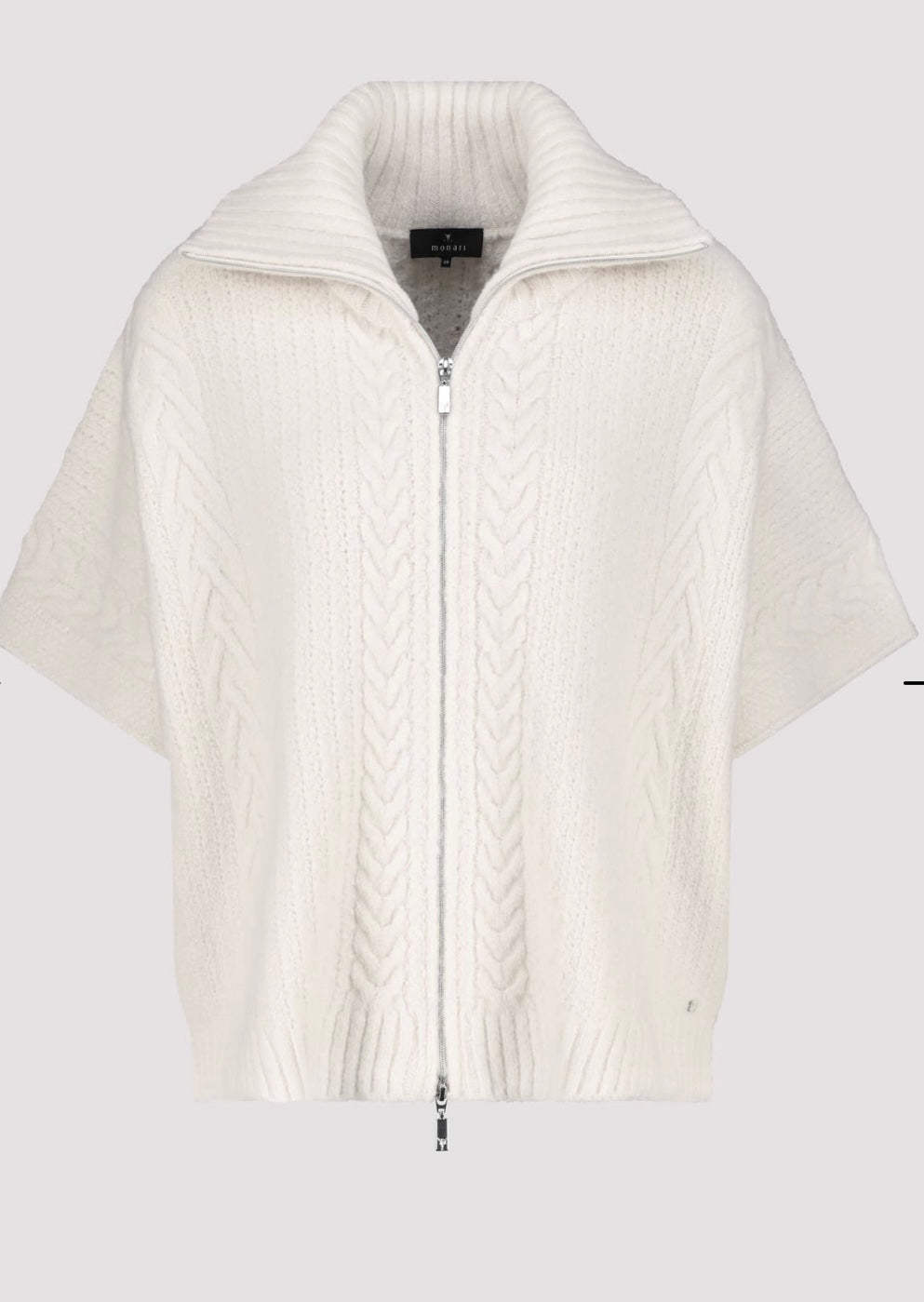 KNITTED CAPE WITH CABLE PATTERN
COLOR: Oat milk