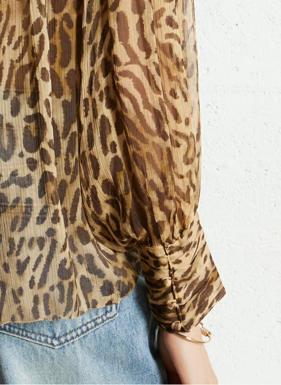 Eco-friendly
New
Suncoo
Flowy printed sheer blouse - Beige – LUX