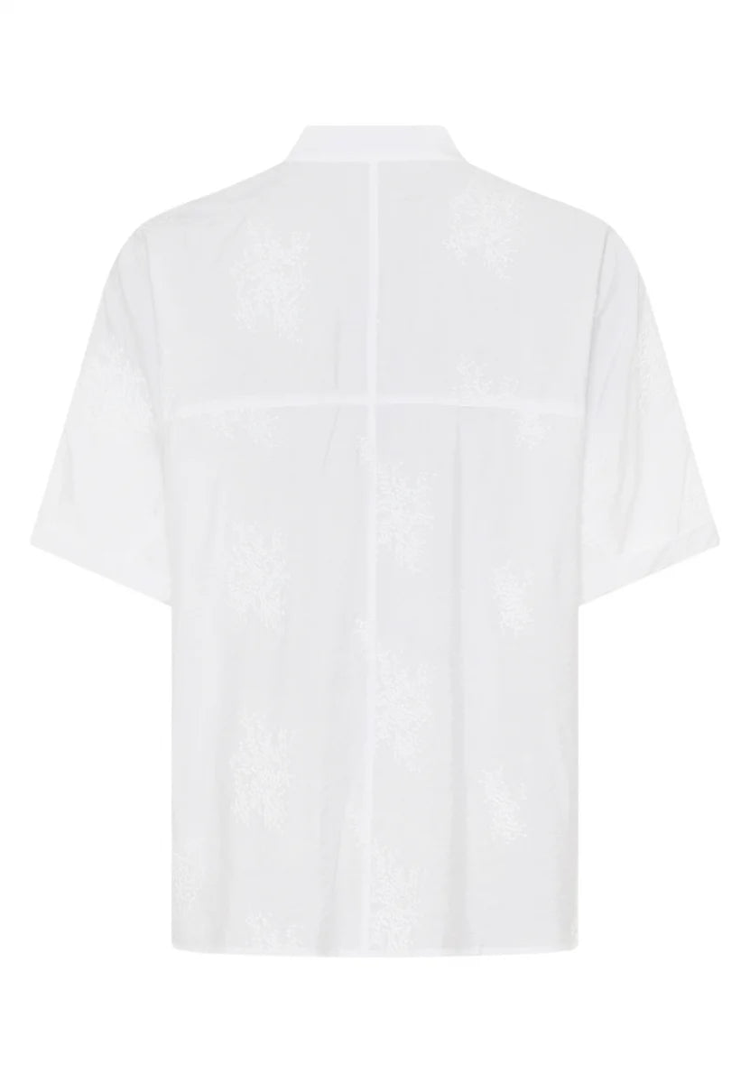 White Tunic blouse made from embroidered fabric
