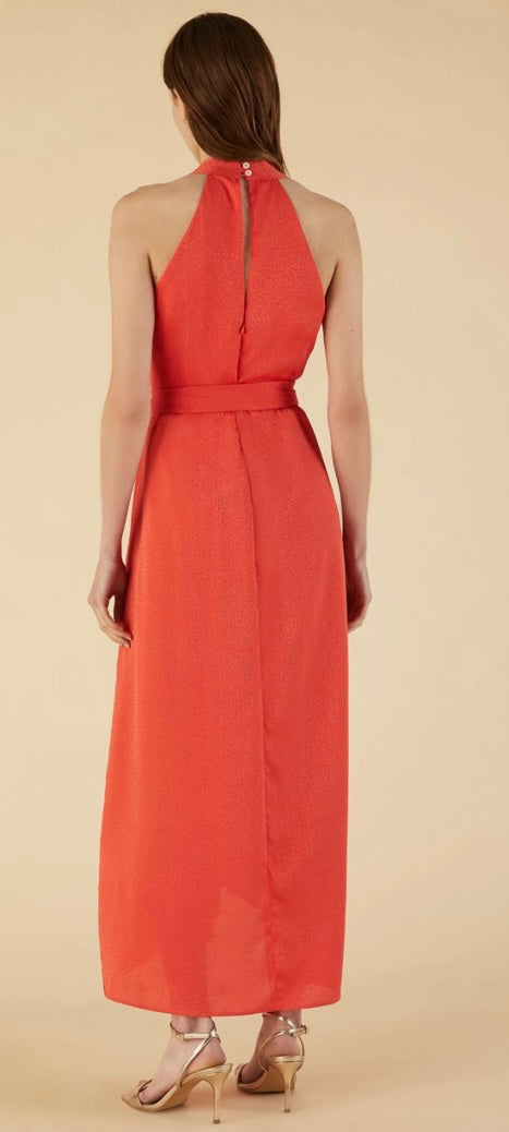 Midi halter neck dress featuring a darted waist. Sleeveless model with a  crossover V-neckline. Concealed zip and button-embellished keyhole back 