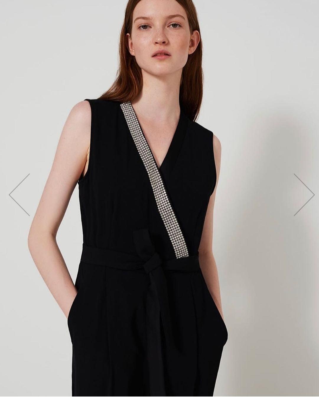 Black jumpsuit with neckline diamante detail